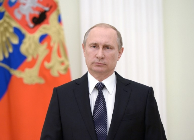 Russian President Vladimir Putin looks on after offering his condolences to French President Francois Hollande at the Kremlin in Moscow on July 15, 2016, the day after a gunman smashed a truck into a crowd of revellers celebrating Bastille Day in Nice, killing at least 84 people. A Tunisian-born man zigzagged a truck through a crowd celebrating Bastille Day in the French city of Nice, killing at least 84 and injuring dozens of children in what President Francois Hollande on July 15 called a "terrorist" attack. / AFP PHOTO / Sputnik / Aleksey Nikolskyi