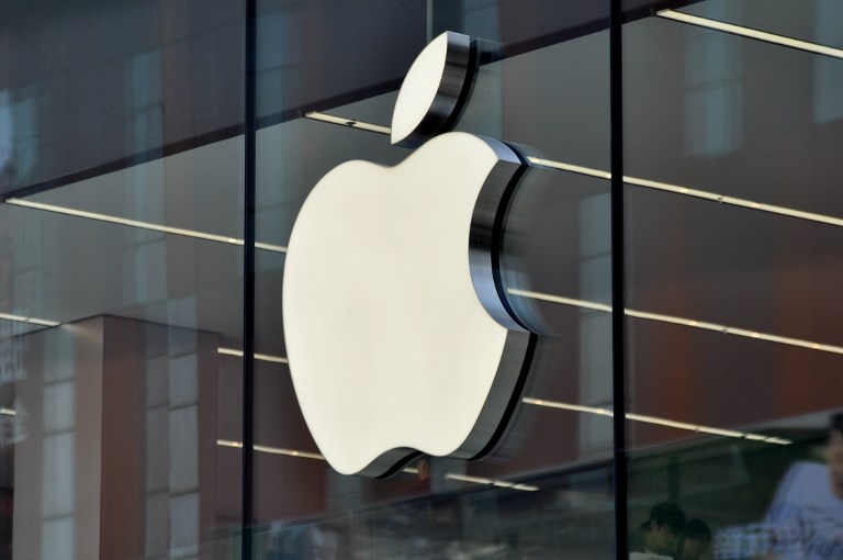 --FILE--The logo of Apple Inc. is on display on the glass facade of an Apple Store in Shenyang city, northeast China's Liaoning province, 10 May 2015. Nasdaq OMX Group Inc. is seeking to tempt Shenzhen stock investors with Apple Inc. and Microsoft Corp. amid a rally in Chinese technology shares that's making the U.S. dot-com bubble look subdued. Nasdaq will start an exchange-traded fund in Shenzhen tracking the Nasdaq 100 Index by early in the third quarter, Robert Hughes, who manages the New York-based company's global indexes business, said in an interview on Wednesday (20 May 2015). It's licensed GF Fund Management Co. to offer the Guangfa Nasdaq-100 Index Fund, which will be Shenzhen's first ETF based on the gauge, he said. The rally that's added more than $5 trillion to the value of Chinese equities over the past year has been even more pronounced in Shenzhen, where the market is dominated by smaller technology companies.