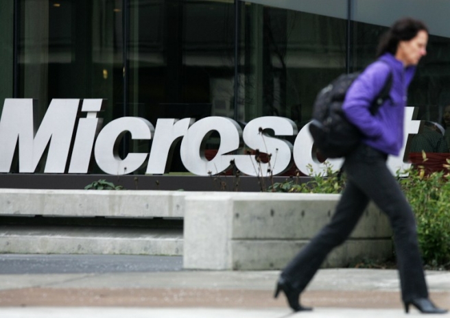 REDMOND, WA - JANUARY 22: A person walks past a Microsoft sign on January 22, 2009 in Redmond, Washington. The company annouced earlier today they would be laying off up to 5000 employees within the next 18 months. Robert Giroux/Getty Images/AFP