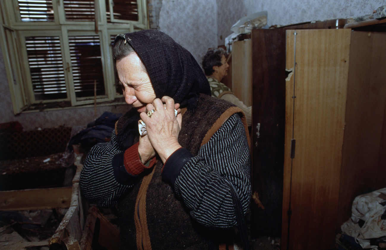 An elderly Croatian woman who survived the three-month battle between the Croatian armed forces and the Yugoslavian Federal Army in Vukovar mourns in her damaged house. The Yugoslavian Federal Army completely destroyed the Croatian city, killing thousands of civilians, while the Serbian Volunteer Guard, formed by Zeljko "Arkan" Raznatovic, was responsible for massive ethnic cleansing campaigns against Bosnian Croats., Image: 15114610, License: Rights-managed, Restrictions: Content available for editorial use, pre-approval required for all other uses. This content may not be materially modified or used in composite content., Model Release: no, Credit line: Profimedia, Corbis