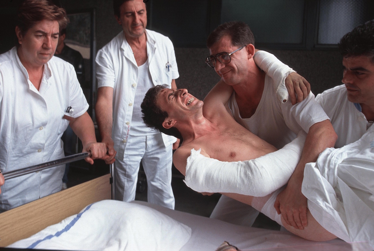 A wounded Croatian man in pain is lowered into a hospital bed in Vukovar, Croatia, which was attacked for three months by Serbian forces and was the last major city to fall before the end of the Croatian war, Aug. 29, 1991. Over 10,000 people were killed in the war between Croatia and Yugoslavia., Image: 116177654, License: Rights-managed, Restrictions: Content available for editorial use, pre-approval required for all other uses. This content not available to be downloaded through Quick Pic Not available for license and invoicing to customers located in the Czech Republic. Not available for license and invoicing to customers located in the Netherlands. Not available for license and invoicing to customers located in India. Not available for license and invoicing to customers located in Finland. Not available for license and invoicing to customers located in Italy., Model Release: no, Credit line: Profimedia, Corbis VII