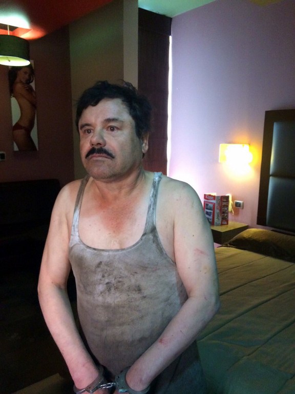 Picture release by Mexican web site "Plaza de Armas" of Joaquin "El Chapo" Guzman recaptured in a hotel in the city of Los Mochis, Sinaloa state in northwest Mexico on January 8, 2016. Mexican marines recaptured fugitive drug kingpin Joaquin "El Chapo" Guzman on Friday in the northwest of the country, six months after his spectacular prison break embarrassed authorities. AFP PHOTO/Plaza de Armas /// RESTRICTED TO EDITORIAL USE-NO MARKETING - NO ADVERTISING CAMPAIGNS - MANDATORY CREDIT AFP PHOTO/PLAZA DE ARMAS - DISTRIBUTED AS A SERVICE TO CLIENTS - GETTY OUT / AFP / Plaza de Armas / HO