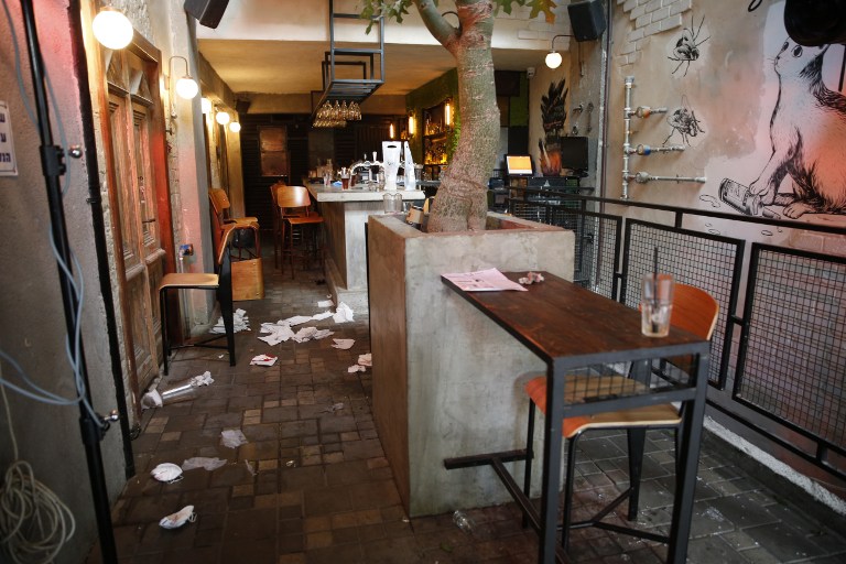 A general view shows the inside of a pub after an unidentified gunman opened fire killing two people and wounding five others in the Israeli city of Tel Aviv on January 1, 2016, police and medical officials said. An eyewitness told Channel 1 television the assailant used an automatic weapon against people at a pub. AFP PHOTO / JACK GUEZ / AFP / JACK GUEZ