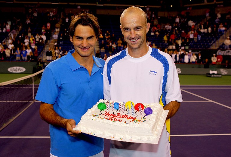 INDIAN WELLS, CA - MARCH 19: Roger Federer of Switzerland presents Ivan Ljubicic of Croatia a cake for his 29th birthday after their match during the Pacific Life Open at the Indian Wells Tennis Garden March 19, 2008 in Indian Wells, California. (Photo by Matthew Stockman/Getty Images)