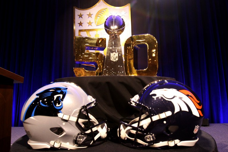 SAN FRANCISCO, CA - FEBRUARY 05: The Vince Lombardi Trophy sits in front of a gold "50" with the helmets of the Carolina Panthers and Denver Broncos before the 2015 Walter Payton Man of the Year Finalist press conference prior to Super Bowl 50 at the Moscone Center West on February 5, 2016 in San Francisco, California. Mike Lawrie/Getty Images/AFP