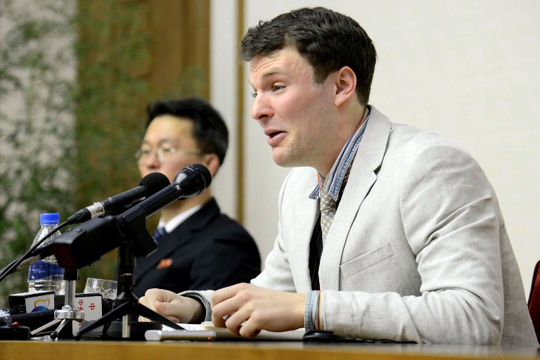 (FILES) This file photo taken on February 29, 2016 shows and released by North Korea's official Korean Central News Agency (KCNA) on March 1, 2016 shows US student Otto Frederick Warmbier (R), who is arrested for committing hostile acts against North Korea, speaking at a press conference in Pyongyang. North Korea on march 16, 2016 sentenced Warmbier, who admitted to stealing propaganda material, to 15 years hard labour for crimes against the state, China's official Xinhua news agency reported. / AFP / KCNA / KCNA VIA KNS