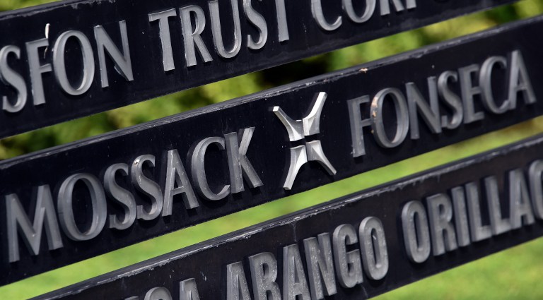 View of a sign outside the building where Panama-based Mossack Fonseca law firm offices are in Panama City, on April 4, 2016. A massive leak -coming from Mossack Fonseca- of 11.5 million tax documents on Sunday exposed the secret offshore dealings of aides to Russian president Vladimir Putin, world leaders and celebrities including Barcelona forward Lionel Messi. An investigation into the documents by more than 100 media groups, described as one of the largest such probes in history, revealed the hidden offshore dealings in the assets of around 140 political figures -- including 12 current or former heads of states. AFP PHOTO/ Rodrigo ARANGUA / AFP / RODRIGO ARANGUA