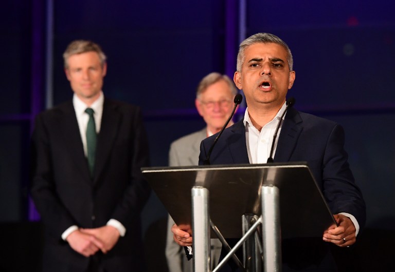 Newly elected London Mayor Sadiq Khan (Foreground) addresses the media following his election victory at City Hall in central London on May 7, 2016. 
London became the first EU capital with a Muslim mayor Friday as Sadiq Khan won the election that saw his opposition Labour party suffer nationwide setbacks. / AFP PHOTO / LEON NEAL