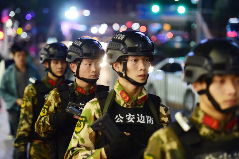 --FILE--Armed Chinese paramilitary policemen patrol a street in Shenzhen city, south China's Guangdong province, 3 March 2016. A proposal submitted to the National People's Congress seeks to expand the role of the armed police and put the force more firmly under the command of the Central Military Commission, a move analysts say would consolidate the power of Chinese President Xi Jinping. Sun Sijing, political commissar of the armed police and a legislator attending the National People's Congress in Beijing, had proposed a legal amendment that would clear the way for the changes, PLA Daily reported this week. The amendment was aimed at ensuring the highest power of command was "firmly in the hands of the Communist Party's central leadership, the CMC and Chairman Xi," it said. The amendment has been under discussion since last June, according to the PLA Daily. The current armed police law, passed in 2009, states that the 660,000-strong force is under the dual leadership of the State Council and the CMC. It also requires the leadership to be shared by central and local commanders. The force is used by local governments to maintain domestic security, fight terrorism and manage social unrest.