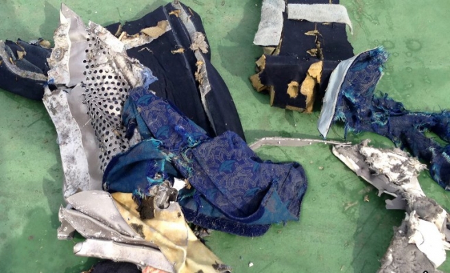 A picture uploaded on the official Facebook page of the Egyptian military spokesperson on May 21, 2016 and taken from an undisclosed location reportedly shows some debris that the search teams found in the sea after the EgyptAir Airbus A320 crashed in the Mediterranean. The Egyptian military spokesman released pictures on his Facebook page of some of the wreckage it recovered so far, including a safety vest and what appeared to be the shredded remains of a seat. EgyptAir flight MS804 sent automated messages signalling smoke onboard before plunging into the Mediterranean, the French aviation safety agency said, as search teams hunted for more wreckage. / AFP PHOTO / Egyptian military spokesperson's facebook page / HO / ===RESTRICTED TO EDITORIAL USE - MANDATORY CREDIT "AFP PHOTO / Egyptian military spokesperson's Facebook page - NO MARKETING NO ADVERTISING CAMPAIGNS - DISTRIBUTED AS A SERVICE TO CLIENTS FROM FROM ALTERNATIVE SOURCES, THEREFORE AFP IS NOT RESPONSIBLE FOR ANY DIGITAL ALTERATIONS TO THE PICTURE'S EDITORIAL CONTENT, DATE AND LOCATION WHICH CANNOT BE INDEPENDENTLY VERIFIED == /