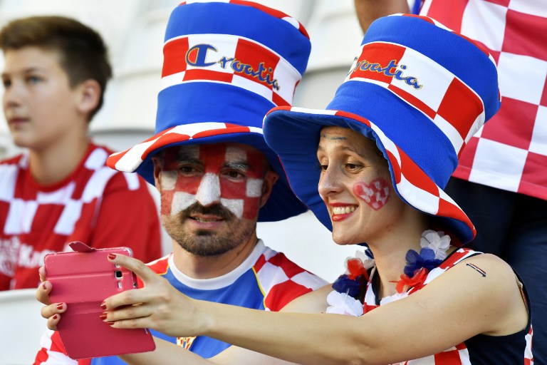 Croatia supporters take a picture during the Euro 2016 group D football match between Croatia and Spain at at the Matmut Atlantique stadium in Bordeaux on June 21, 2016. / AFP PHOTO