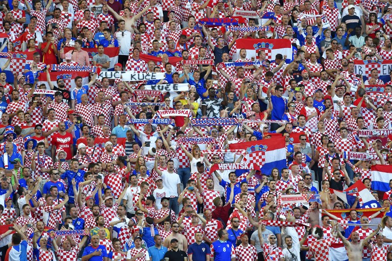 Croatia supporters cheer during the Euro 2016 group D football match between Croatia and Spain at the Matmut Atlantique stadium in Bordeaux on June 21, 2016. / AFP PHOTO / LOIC VENANCE
