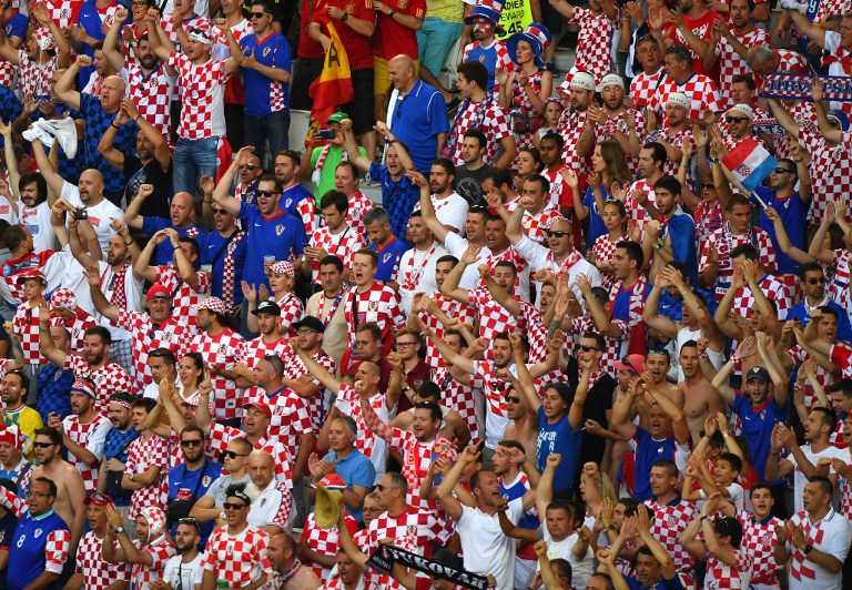 Croatia supporters cheer during the Euro 2016 group D football match between Croatia and Spain at the Matmut Atlantique stadium in Bordeaux on June 21, 2016. / AFP PHOTO / MEHDI FEDOUACH