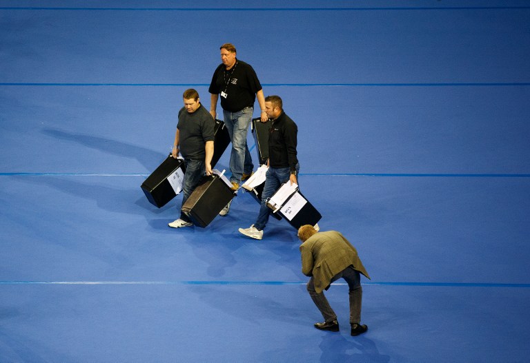Ballot boxes are brought into the Glasgow count centre at the Emirates Arena, Glasgow, Scotland, on June 23, 2016 after polls closed in the referendum on whether the UK will remain or stay in the European Union (EU). Millions of Britons began voting Thursday in a bitterly-fought, knife-edge referendum that could tear up the island nation's EU membership and spark the greatest emergency of the bloc's 60-year history. / AFP PHOTO / Robert Perry