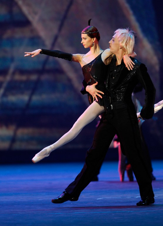 Ballet dancers Nina Kaptsova and Pavel Dmitrichenko perform "Tango" from Shostakovich's ballet "The Golden Age" during a gala concert marking the reopening of the historic Bolshoi Theatre after a six-year renovation.