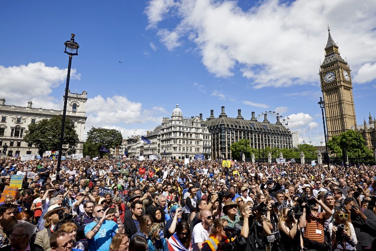 Thousands of protesters gather in Parliament Square as they take part in a March for Europe, through the centre of London on July 2, 2016, to protest against Britain's vote to leave the EU, which has plunged the government into political turmoil and left the country deeply polarised. Protesters from a variety of movements march from Park Lane to Parliament Square to show solidarity with those looking to create a more positive, inclusive kinder Britain in Europe. / AFP PHOTO / Niklas HALLE'N