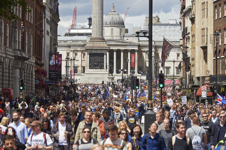 Thousands of protesters file down Whitehall as they take part in a March for Europe, through the centre of London on July 2, 2016, to protest against Britain's vote to leave the EU, which has plunged the government into political turmoil and left the country deeply polarised. Protesters from a variety of movements march from Park Lane to Parliament Square to show solidarity with those looking to create a more positive, inclusive kinder Britain in Europe. / AFP PHOTO / Niklas HALLE'N