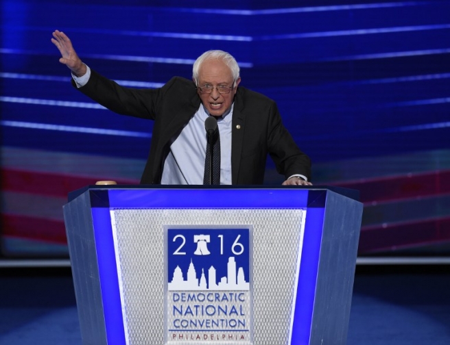 Vermont Senator and former Democratic presidential candidate Bernie Sanders addresses the Democratic National Convention at the Wells Fargo Center in Philadelphia, Pennsylvania, July 25, 2016. Vanquished White House hopeful Bernie Sanders told a riven and lively Democratic convention that his rival Hillary Clinton must win the US presidential election in November / AFP PHOTO / SAUL LOEB