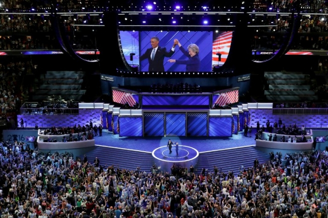 PHILADELPHIA, PA - JULY 27: US President Barack Obama and Democratic presidential nominee Hillary Clinton acknowledge the crowd on the third day of the Democratic National Convention at the Wells Fargo Center, July 27, 2016 in Philadelphia, Pennsylvania. Democratic presidential candidate Hillary Clinton received the number of votes needed to secure the party's nomination. An estimated 50,000 people are expected in Philadelphia, including hundreds of protesters and members of the media. The four-day Democratic National Convention kicked off July 25. Chip Somodevilla/Getty Images/AFP