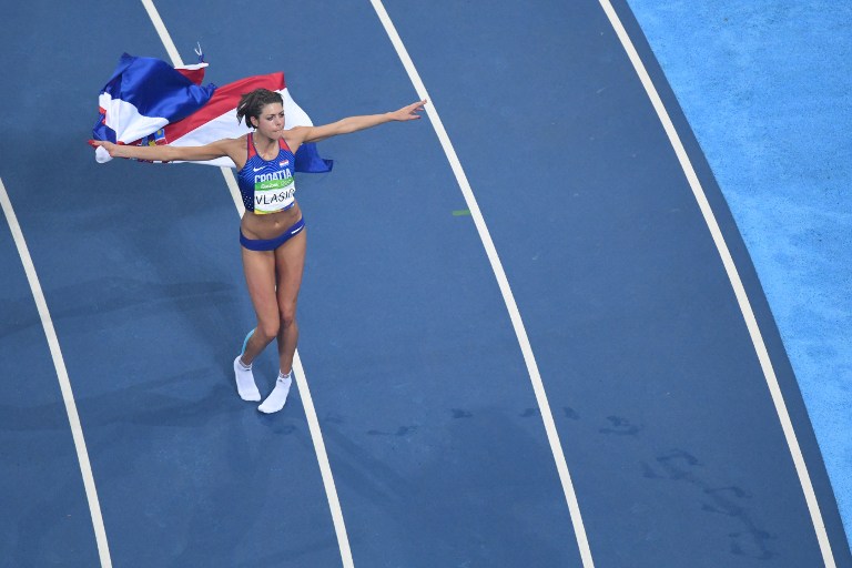 Croatia's Blanka Vlasic celebrates winning the bronze medal in the Women's High Jump Final during the athletics event at the Rio 2016 Olympic Games at the Olympic Stadium in Rio de Janeiro on August 20, 2016. / AFP PHOTO / FRANCK FIFE