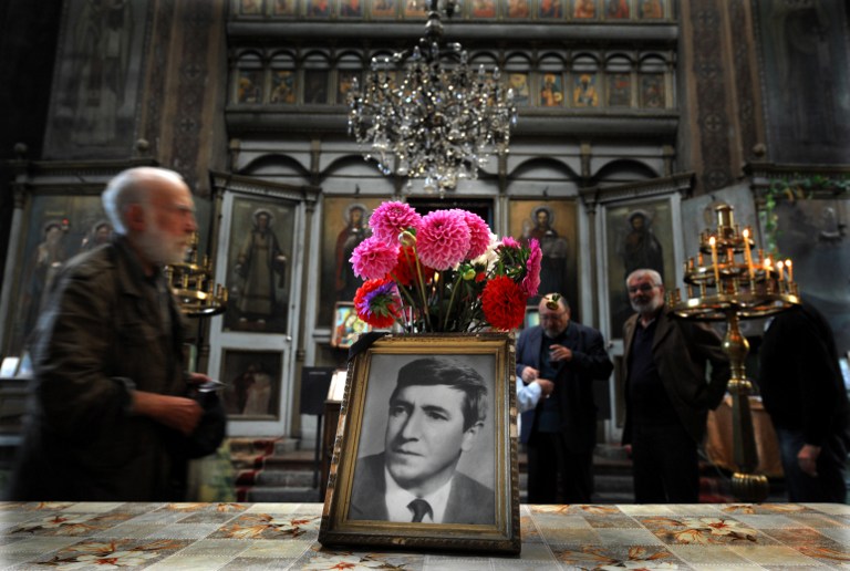 People attend a commemoration service marking 35 years of the dead of Georgi Markov, a bulgarian disident killed in London in 1978, in a church in Sofia on September 11, 2013. Bulgaria is set to close a 35-year probe into the spectacular "umbrella killing" of dissident Georgy Markov in London in 1978, the prosecution in Sofia said Monday. Markov's murder has gone down as one of the most daring and extraordinary crimes of the Cold War. The prominent journalist and playwright fled communist Bulgaria in 1969 for Britain but continued to lambast the regime in reports for the BBC and Radio Free Europe. AFP PHOTO / NIKOLAY DOYCHINOV / AFP PHOTO / NIKOLAY DOYCHINOV