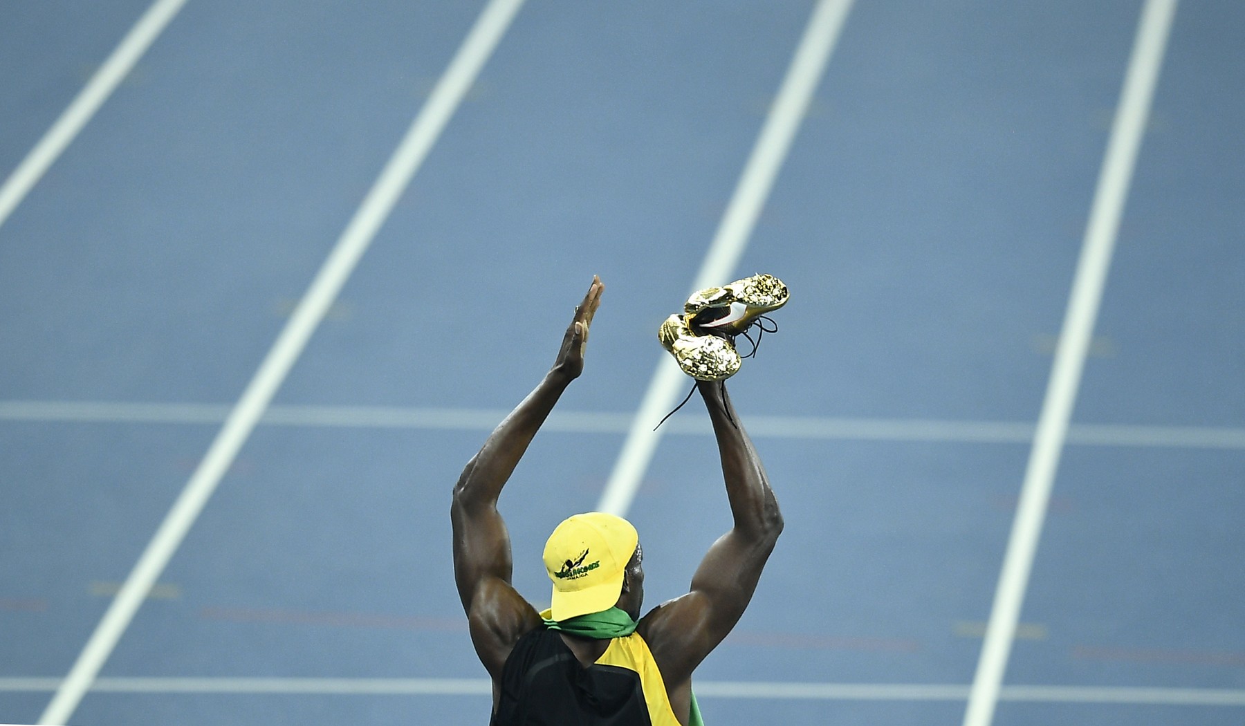 Bolt wins third 100 M gold