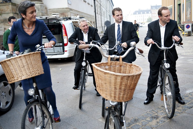 New Danish Ministers (L to R) Margrethe Vestager, Minister for economy and Interior affairs, Uffe Elbaek, Minister for culture, Morten Oestergaard, Minister for science and innovation and Martin Lidegaard, Minister for energy and climate, pose on bicycles on their way to the Royal Castle, Amalienborg, to be presented to Queen Margrethe on October 3, 2011. AFP PHOTO / AFP PHOTO / SCANPIX DENMARK / MARIE HALD