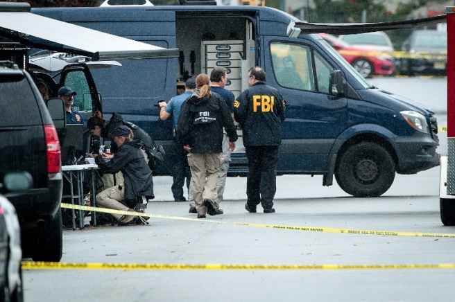 LINDEN, NJ - SEPTEMBER 19: Members of the Federal Bureau of Investigation (FBI) work at the site where Ahmad Khan Rahami, who was wanted in connection to Saturday night's bombing in Manhattan, was arrested after a shootout with police, September 19, 2016 in Linden, New Jersey. On Monday morning, law enforcement released a photograph of 28-year-old Ahmad Khan Rahami, who they are seeking in connection to the attack. Drew Angerer/Getty Images/AFP