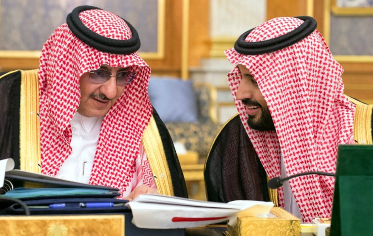 A handout picture provided by the Saudi Press Agency (SPA) on June 7, 2016, shows Saudi Crown Prince and Minister of Interior, Prince Mohammed bin Nayef (L), and deputy crown prince and Minister of Defence, Prince Mohammed bin Salman, attending a cabinet meeting in coastal city of Jeddah. In a press conference in Jeddah, officials revealed sweeping plans to create some 450,000 non-government jobs by 2020, boost non-oil revenues and cut the cost of public wages. The National Transformation Programme (NTP), endorsed by the Saudi cabinet late on June 6, is part of Saudi Vision 2030, a reform drive led by Deputy Crown Prince Mohammed bin Salman, the 30-year-old son of King Salman. / AFP PHOTO / SPA / HO / RESTRICTED TO EDITORIAL USE - MANDATORY CREDIT "AFP PHOTO / HO / SPA" - NO MARKETING NO ADVERTISING CAMPAIGNS - DISTRIBUTED AS A SERVICE TO CLIENTS