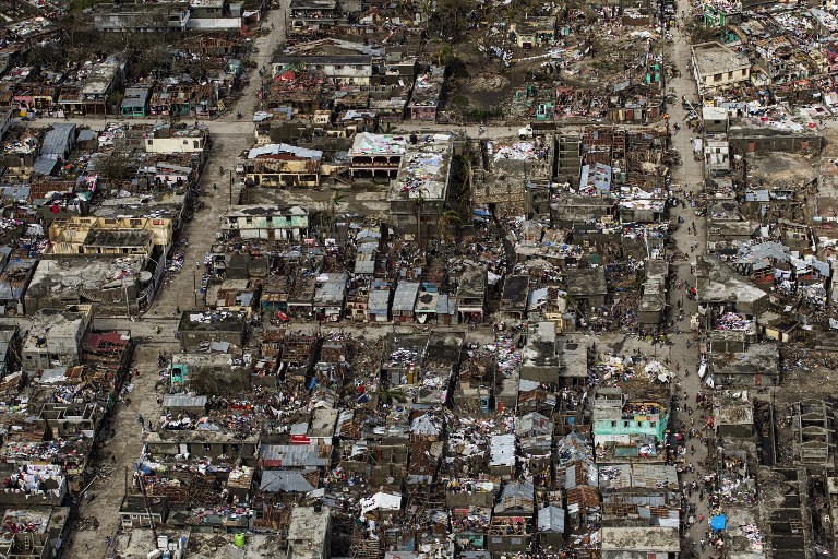 Aerial view taken by the UN Mission in Haiti (MINUSTAH) over the town of Jeremie, Haiti on Thursday October 6, 2016. The city lies on the western tip of Haiti and suffered the full force of the category 4 storm, leaving tens of thousands stranded. Hurricane Matthew passed over Haiti on Tuesday October 4, 2016, with heavy rains and winds. While the capital Port au Prince was mostly spared from the full strength of the class 4 hurricane, the western cities of Les Cayes and Jeremie received the full force sustaining wind and water damage across wide areas. / AFP PHOTO / UN/MINUSTAH / Logan Abassi / RESTRICTED TO EDITORIAL USE - MANDATORY CREDIT "AFP PHOTO /LOGAN ABASSI / MINUSTAH " - NO MARKETING - NO ADVERTISING CAMPAIGNS - DISTRIBUTED AS A SERVICE TO CLIENTS