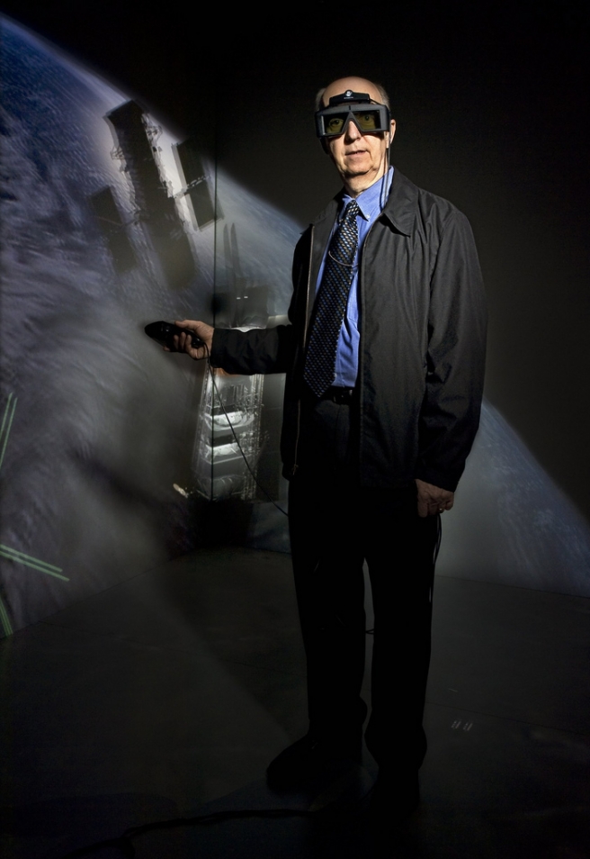 Aerospace engineer Dave Folta goes spelunking in the Goddard CAVE, a fully immersive visualization facility that simulates an orbital environment to an unprecedented level of realism. Folta and his colleague, Steve Queen, began developing the CAVE about three years ago. Their goal was to create a tool that would allow engineers to “see” complex space systems before committing to an actual design. The Goddard CAVE is now open for business. Photo Credit: Chris Gunn Spring 2009