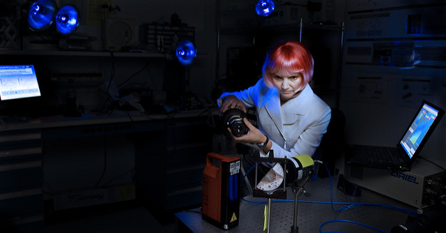 Betsy Pugel, who works with Goddard’s Ultraviolet Detectors Group, demonstrates her non-destructive and portable technique for testing candidate materials for thermal- protection systems on next-generation spacecraft. Photo Credit: Chris Gunn Spring 2007