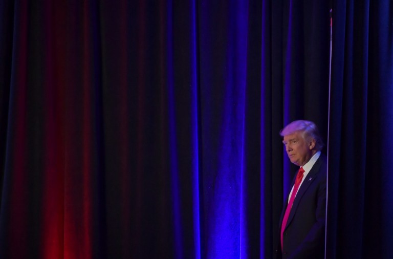 Republican presidential elect Donald Trump arrive to speak during election night at the New York Hilton Midtown in New York on November 9, 2016. / AFP PHOTO / JIM WATSON