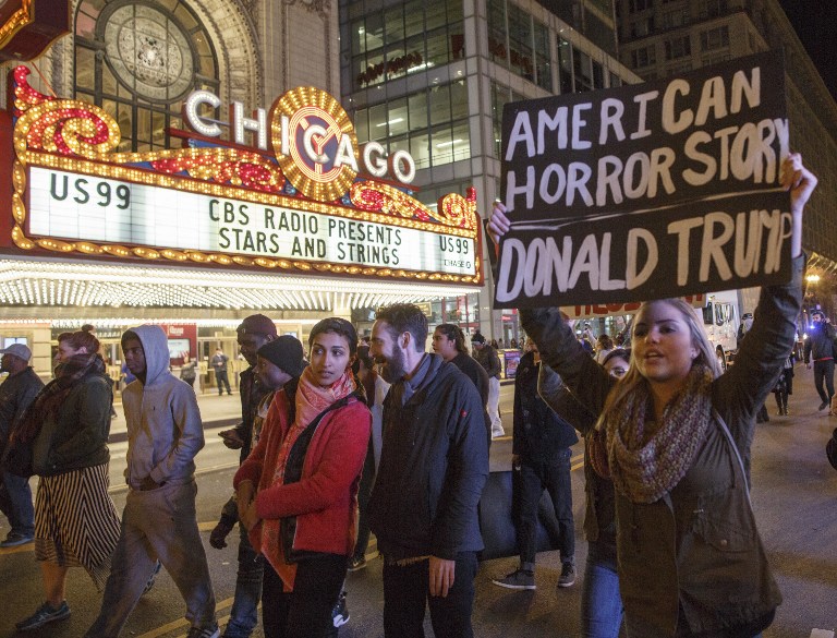 CHICAGO, IL - NOVEMBER 09: Demonstrators protest outside the Chicago Theatre November 9, 2016 in Chicago, Illinois. Thousands of people across the United States took to the streets in protest a day after Republican Donald Trump was elected president, defeating Democrat Hillary Clinton. John Gress/Getty Images/AFP