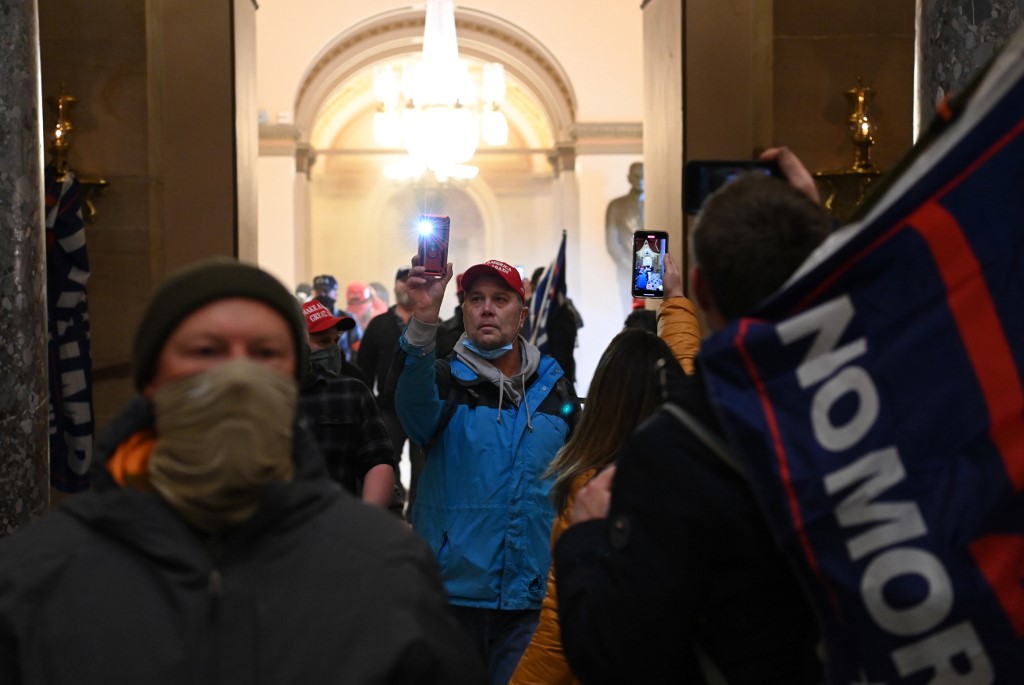 Supporters of US President Donald Trump enter the US Capitol on January 6, 2021, in Washington, DC. - Demonstrators breeched security and entered the Capitol as Congress debated the a 2020 presidential election Electoral Vote Certification. (Photo by Saul LOEB / AFP)