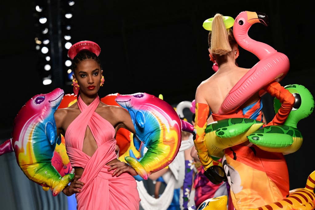 Models present creations for Moschino's Women's Spring Summer 2023 fashion collection on September 22, 2022 in Milan. (Photo by MIGUEL MEDINA / AFP)